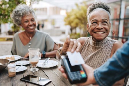 Istock 2229608915 Older People Paying With Card Resized